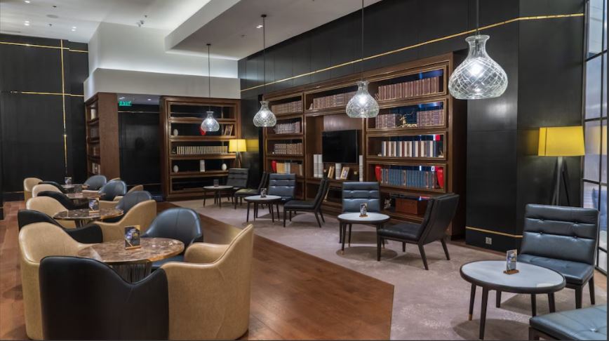 Premium escort agencies enforcing secure zero-upfront fee policies for corporate clients in a luxury Dhaka hotel lounge.
